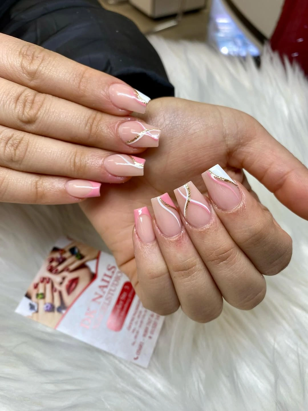 short blush coffin nails with looping white line art and sparkle