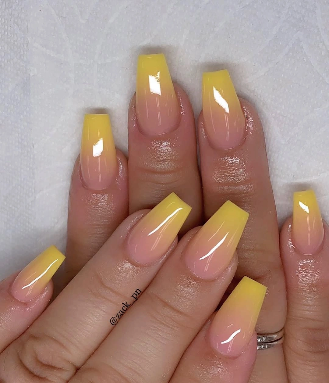 glossy nude coffin nails with saturated mustard yellow tips