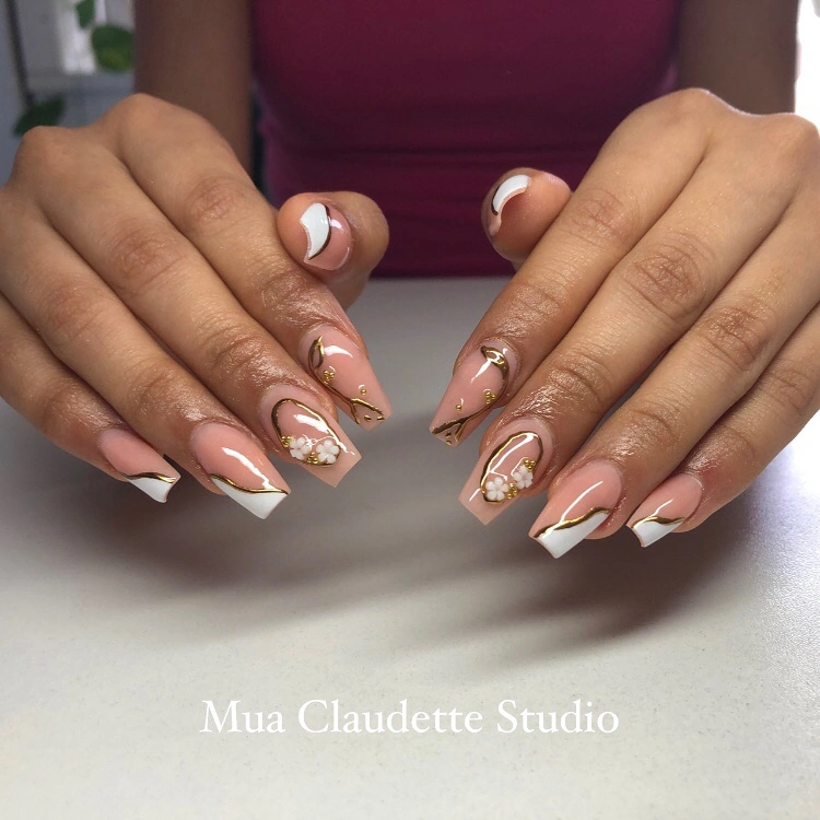 short nude coffin nails with curved white lines and dark accents