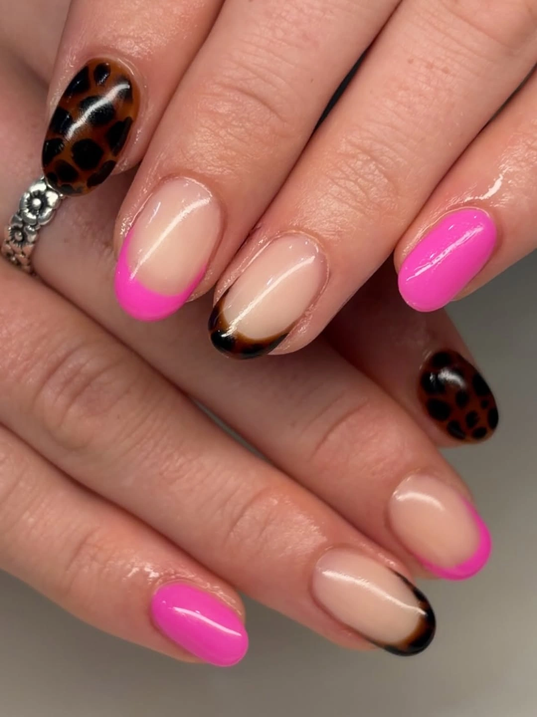 Hot pink short nails with tortoiseshell accents