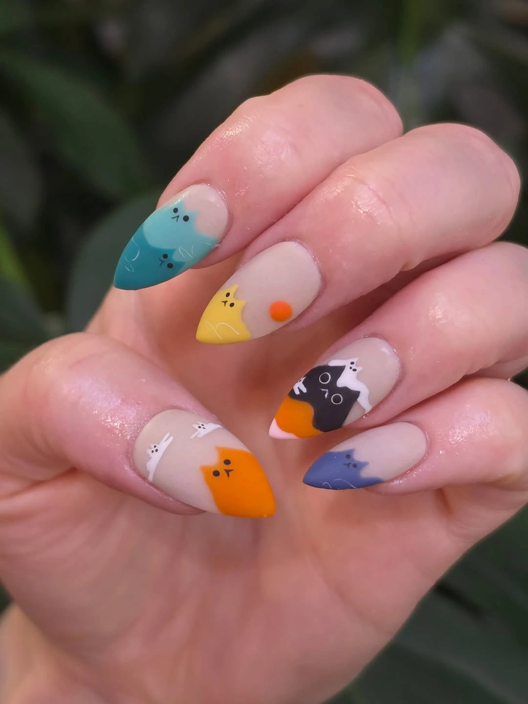 Short almond nails with colorful cat-tip art