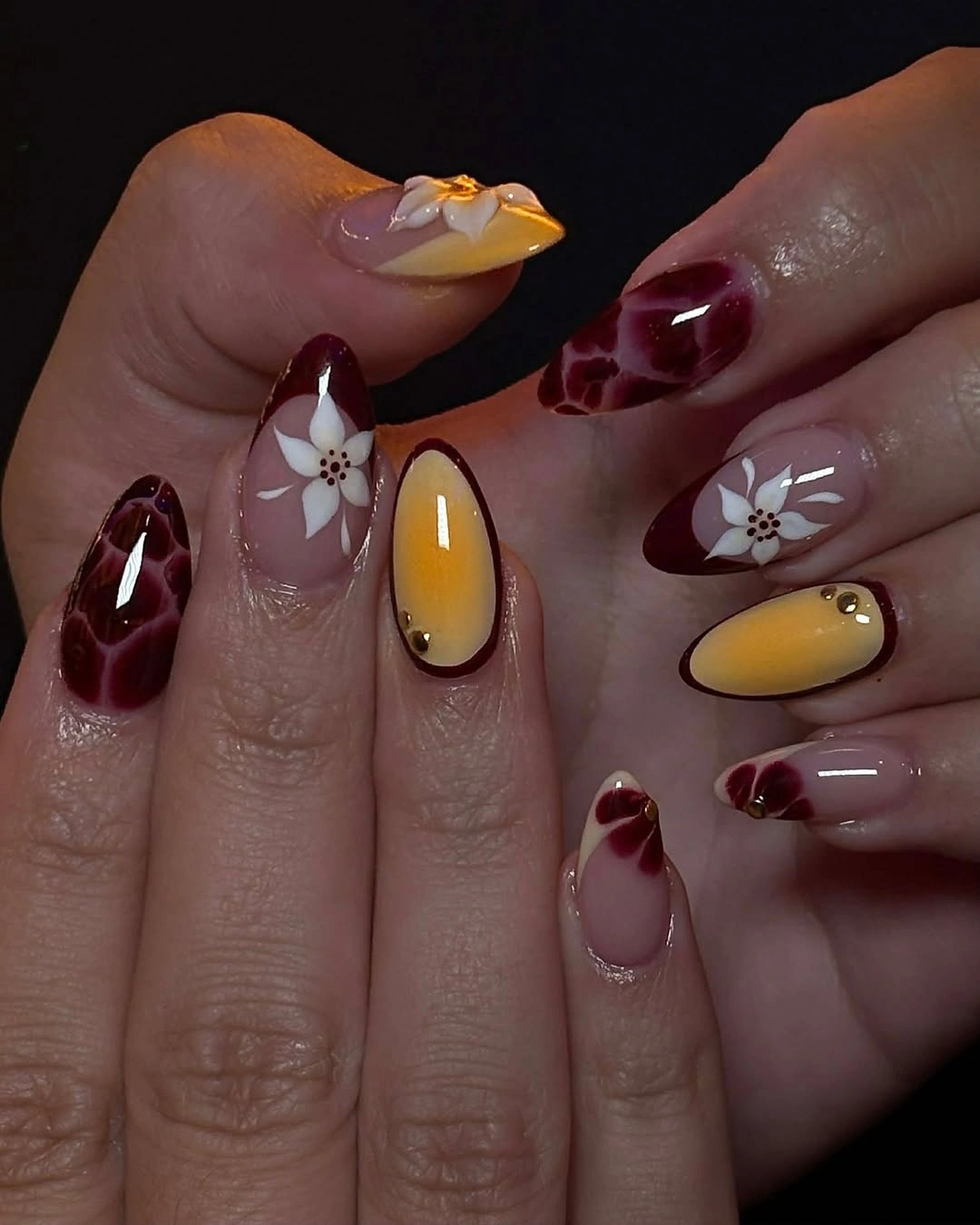 Mustard and burgundy short almond floral nails