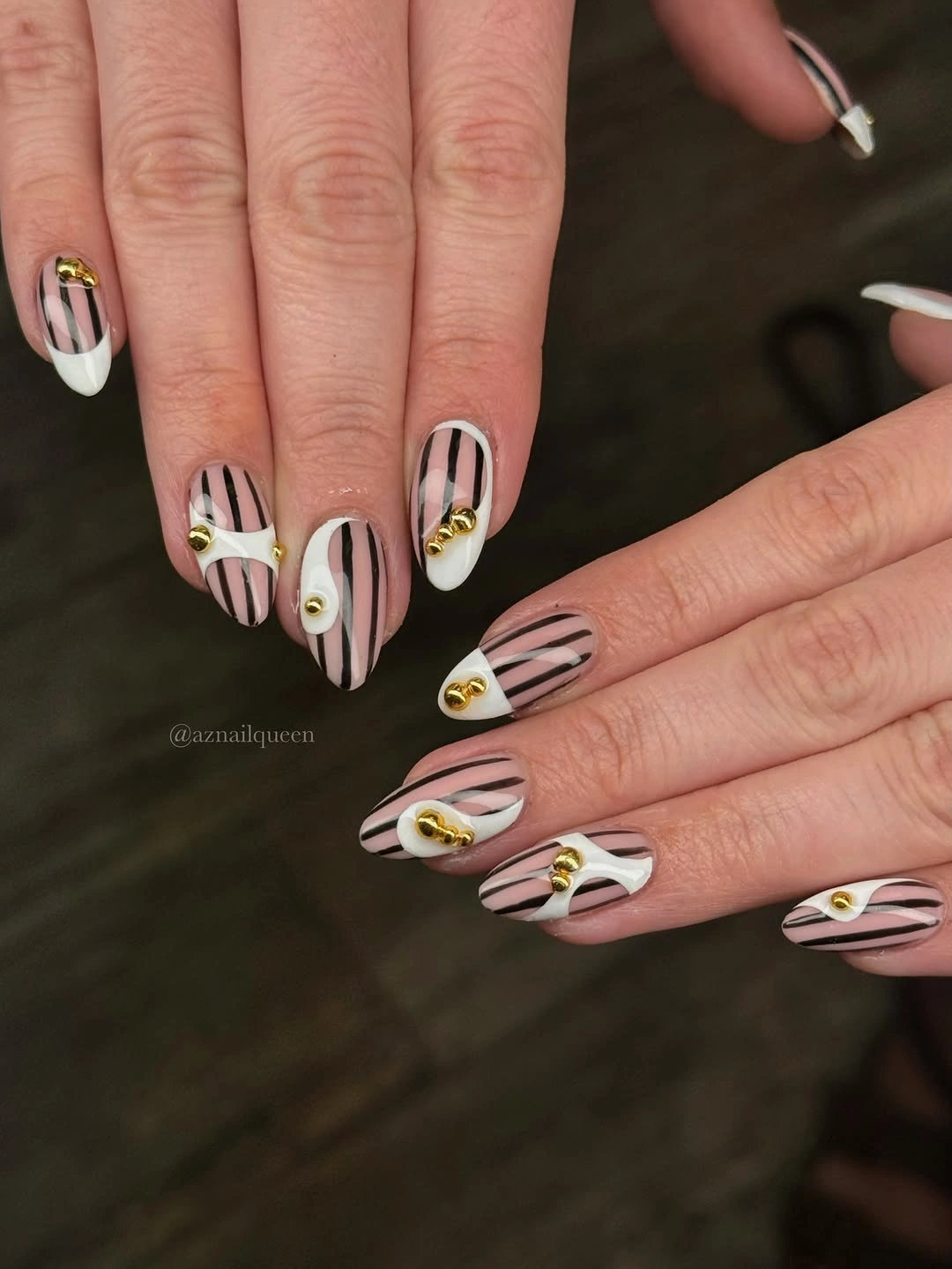 Striped sheer short almond nails with gold beads