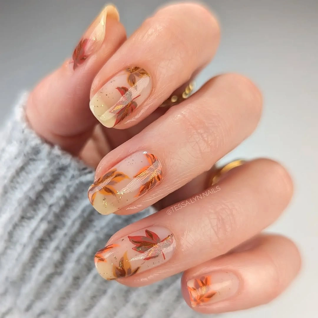 Sheer amber short nails with fine fall leaves