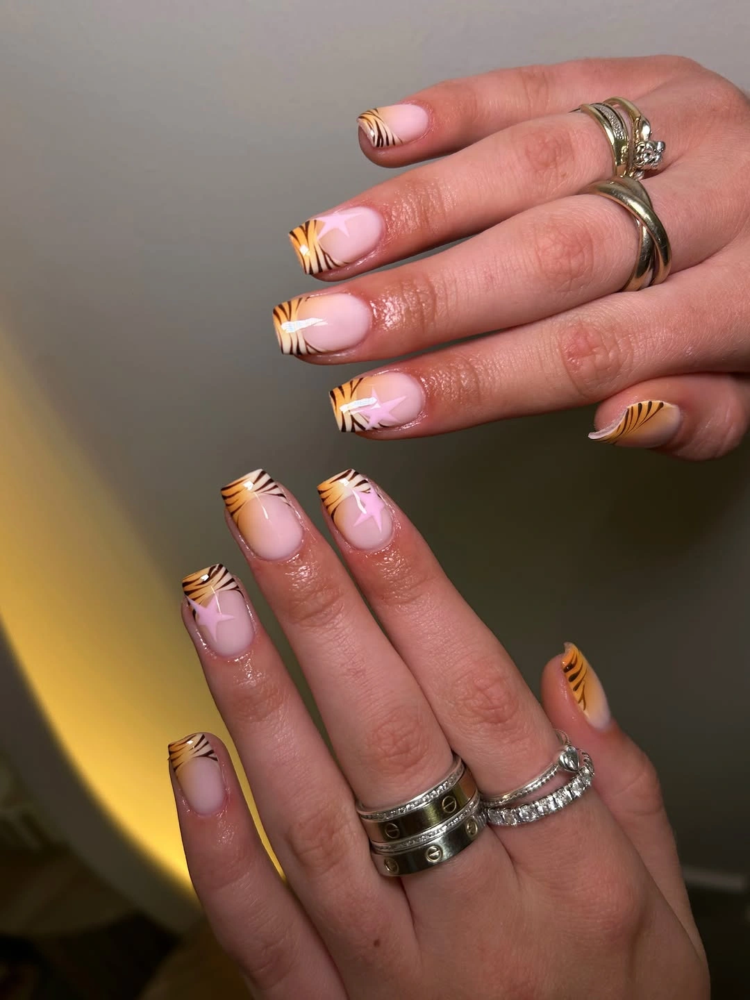 Short sheer pink square nails with narrow warm striped micro French tips