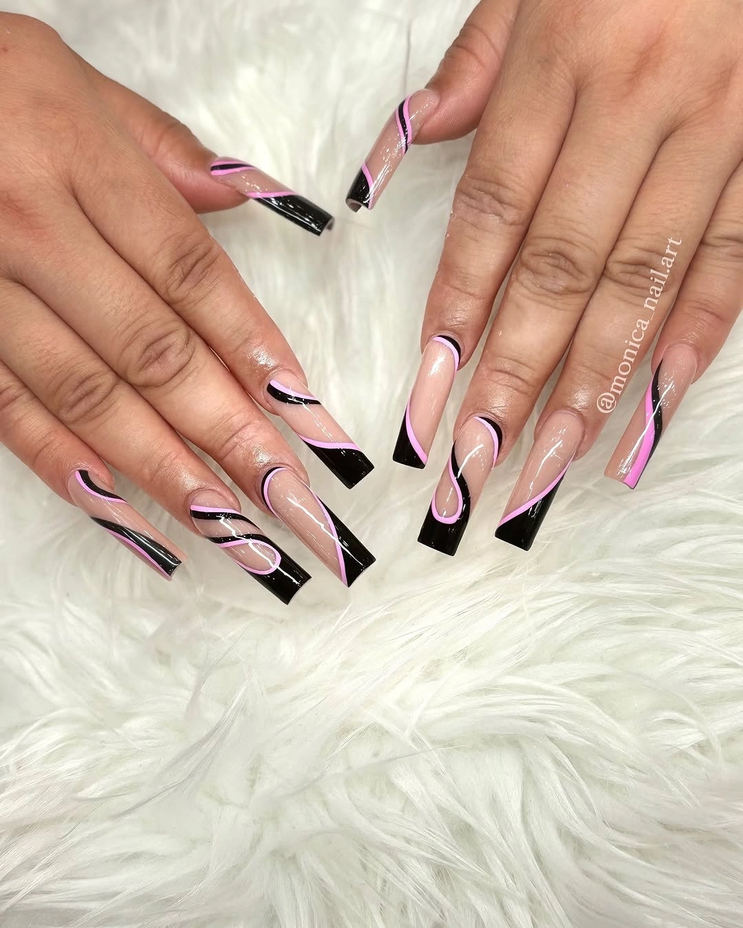 Pale pink square nails with sharp black wedge French tips and fine lines