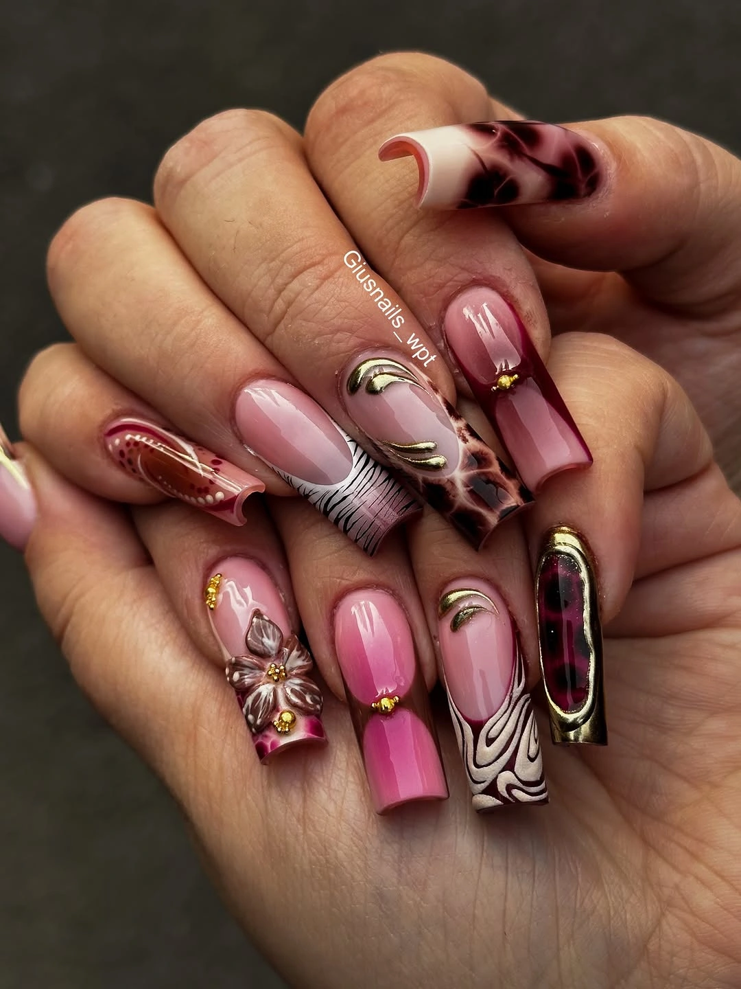 Long rose pink square nails with mixed tortoiseshell and graphic accents
