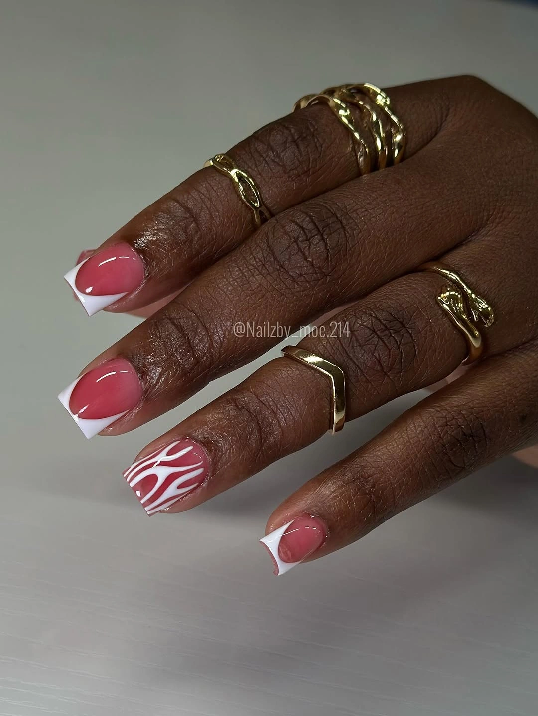 Long rose square nails with curved white ribbon-like graphic tips