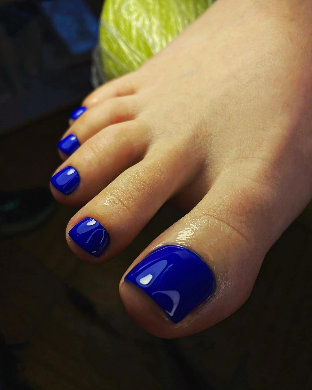Short coral orange toenails with one iridescent flake accent big toe