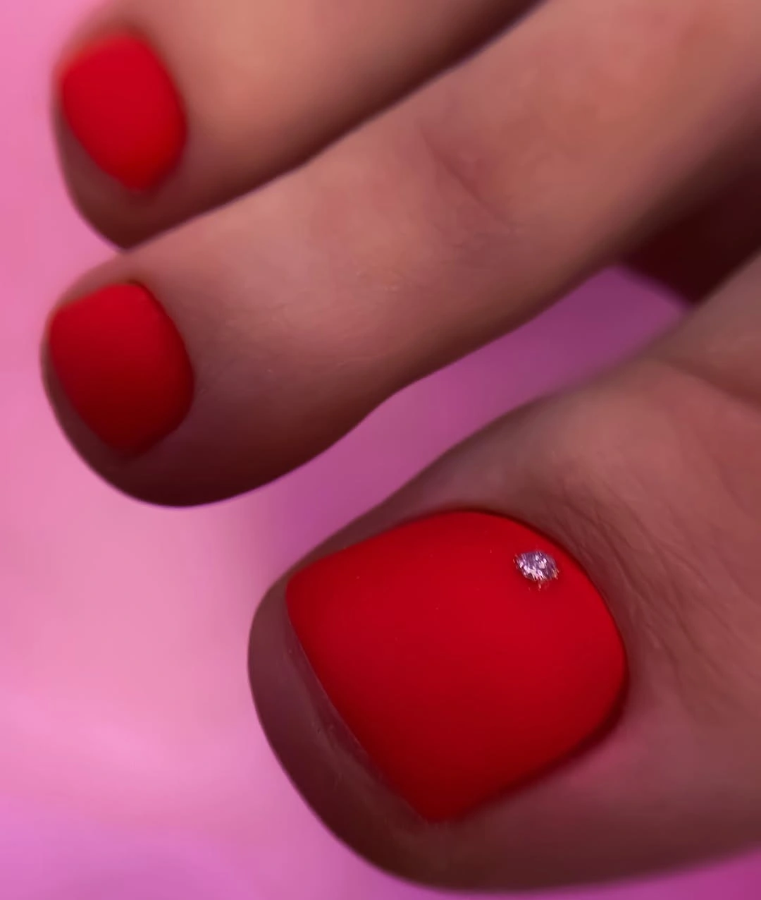 Short blush toenails with one muted taupe leopard print big toe