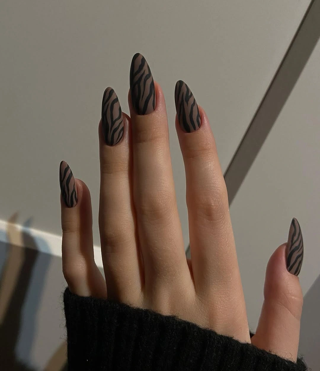 Long almond nails with plum blush and white curved graphic panels