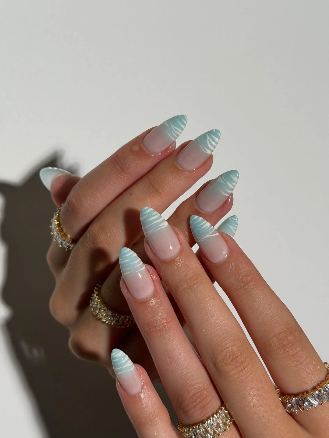 Medium pink French almond nails with one lime glitter accent nail