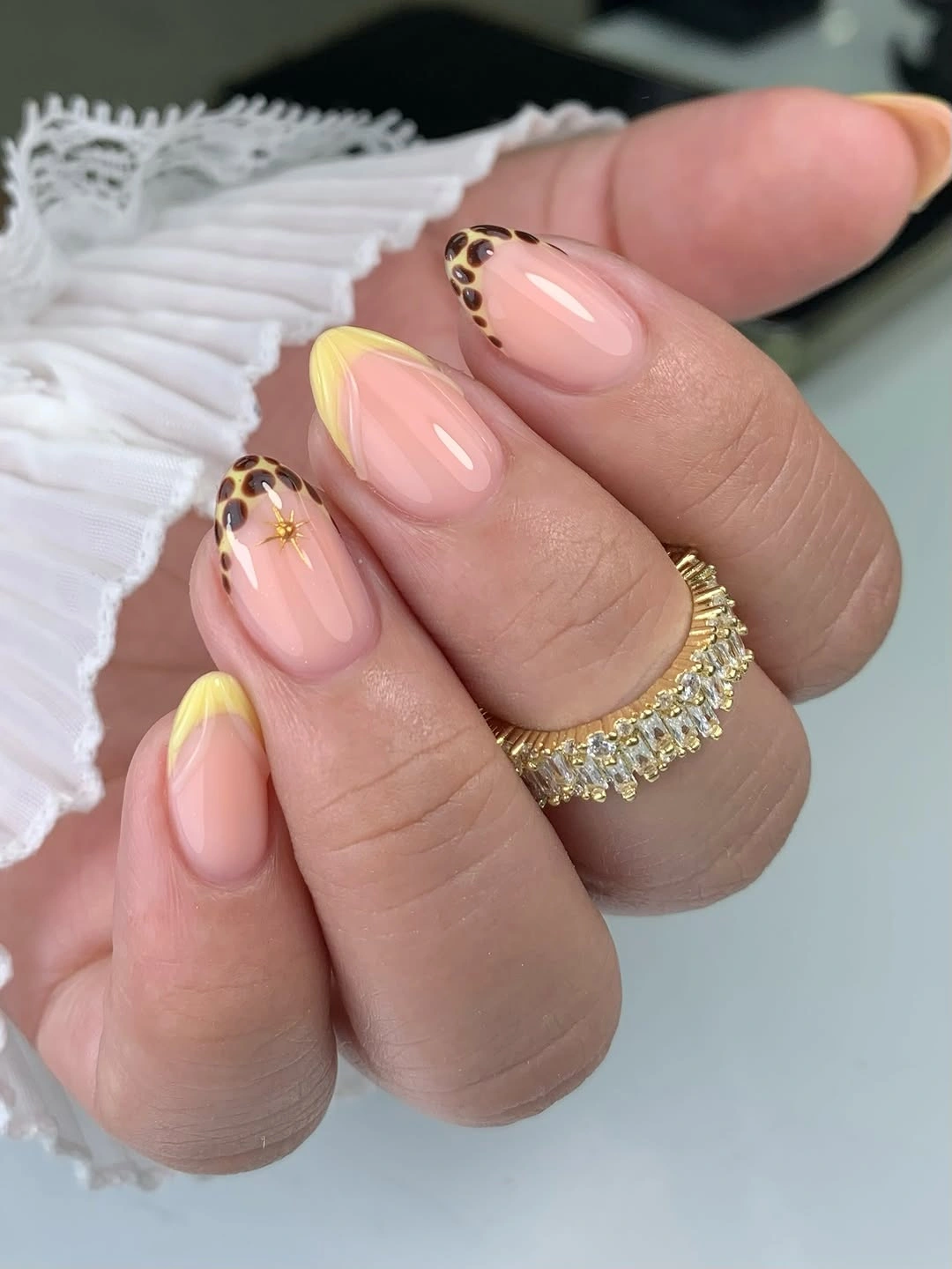 Short square nails in a uniform glossy creamy pale yellow shade