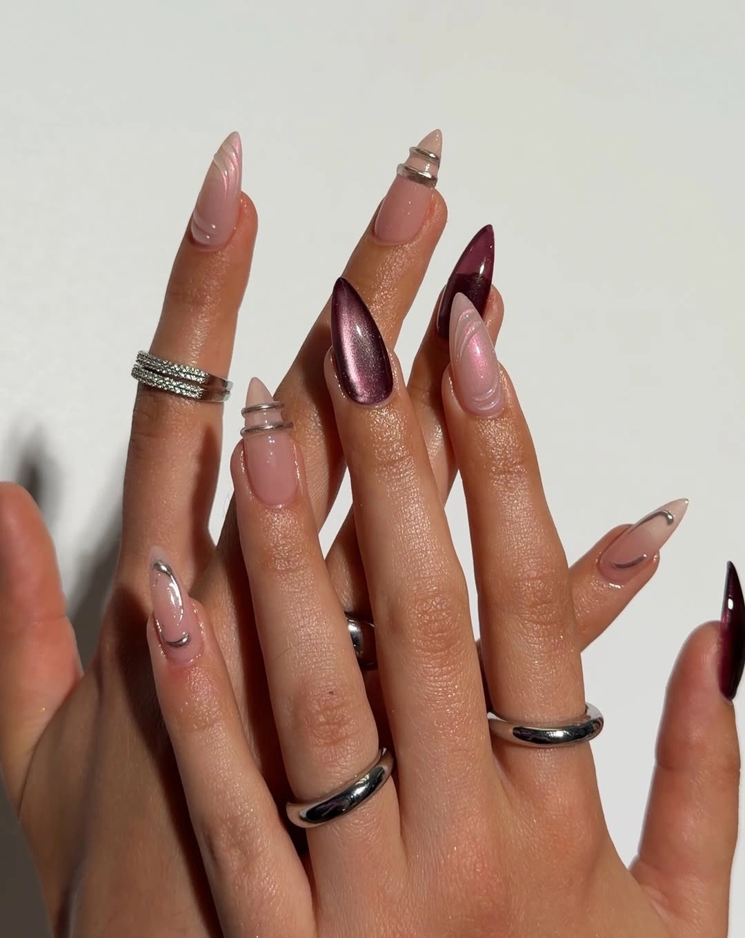 Long blush almond nails with pale blue white wavy French tips