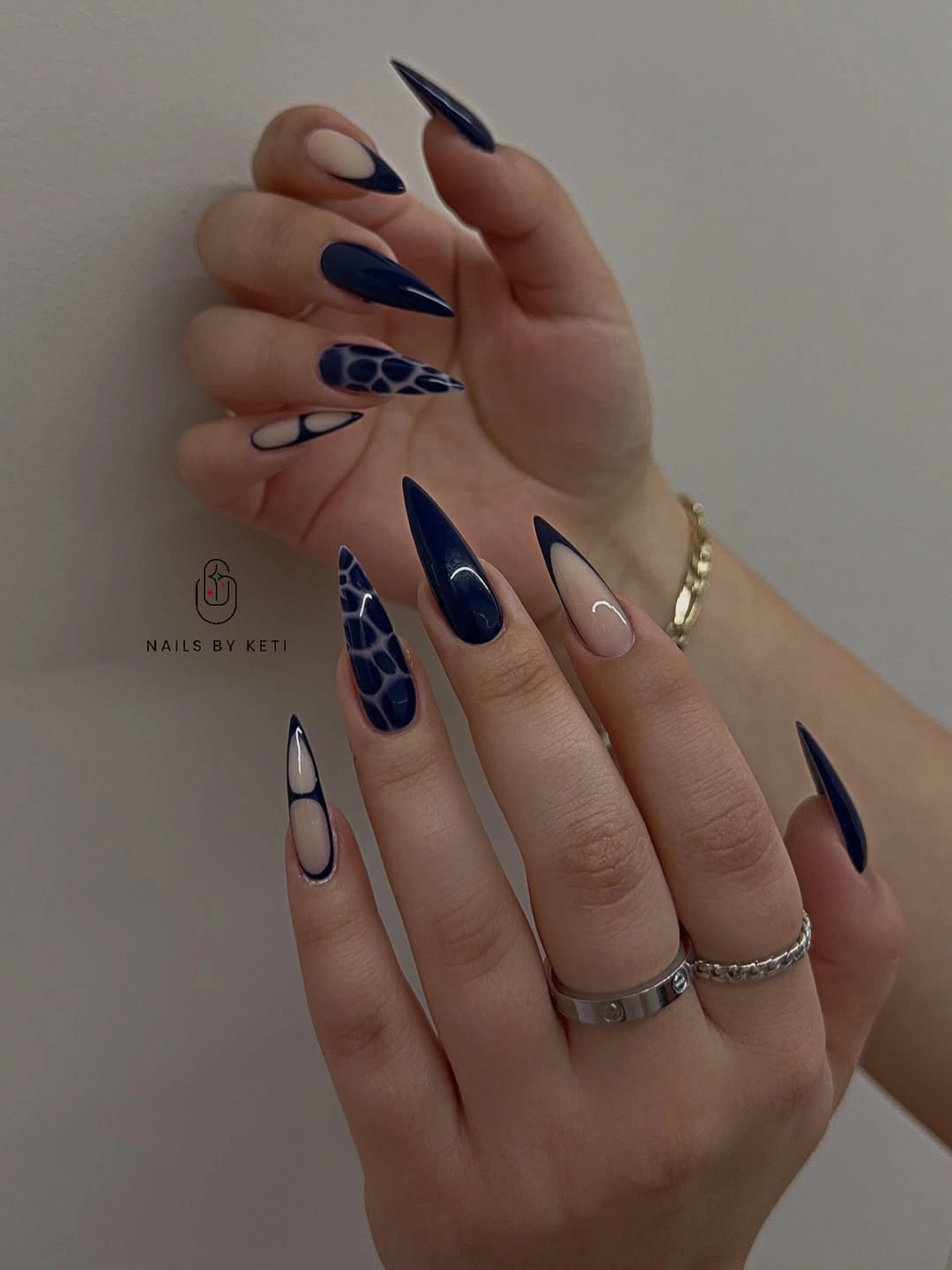 Medium almond nails with yellow French tips and small leopard accents