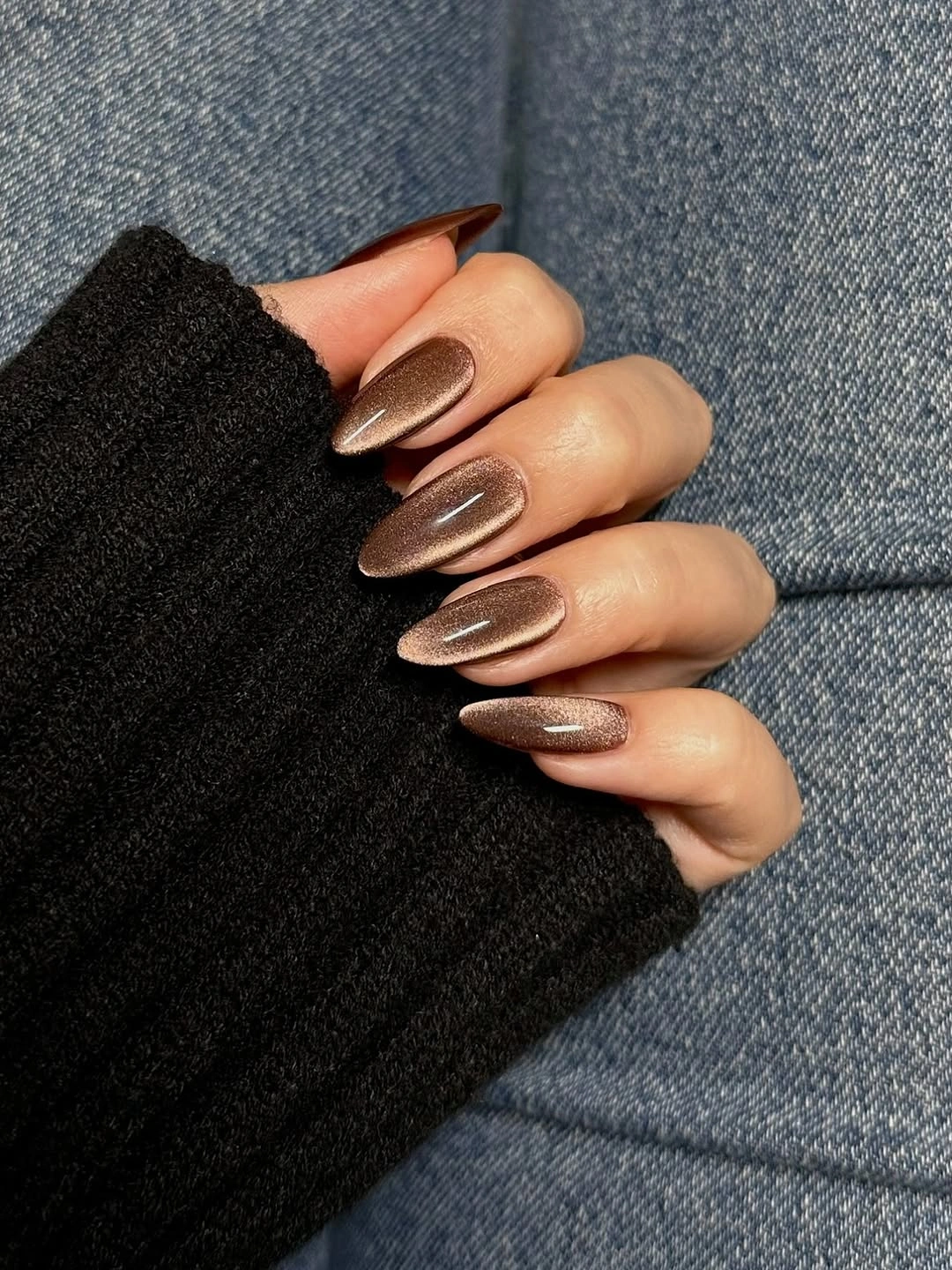 Medium almond wedding nails with a reflective bronze brown chrome finish