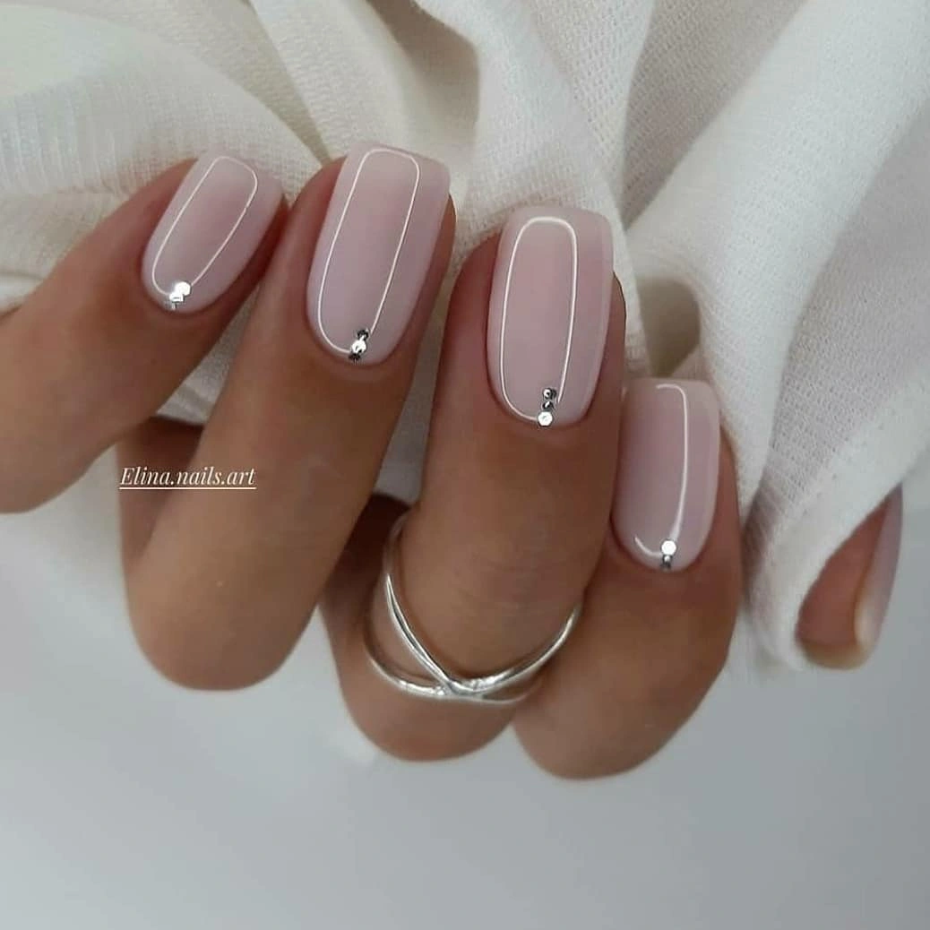 Short square sheer pink wedding nails with tiny silver bead accents