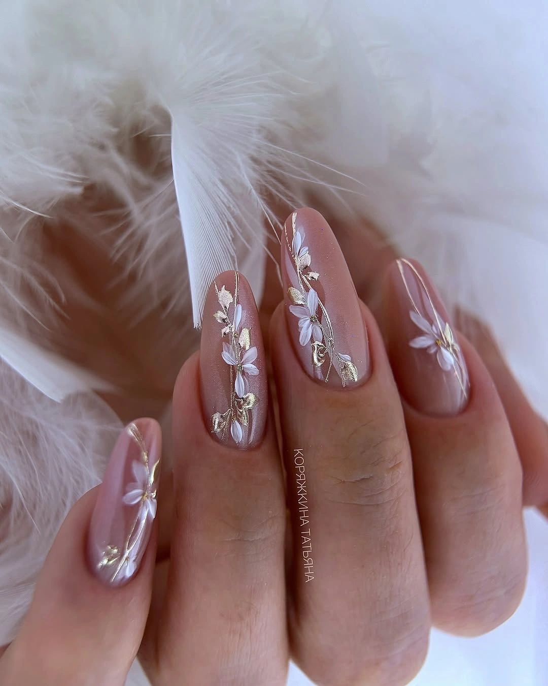 Long pale pink almond wedding nails with white flowers silver charms and crystals