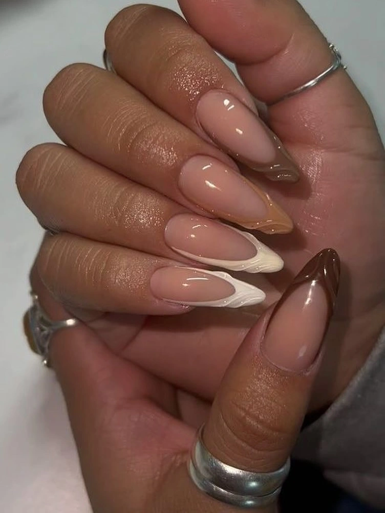 Medium almond wedding nails with soft brown and white curved French tips