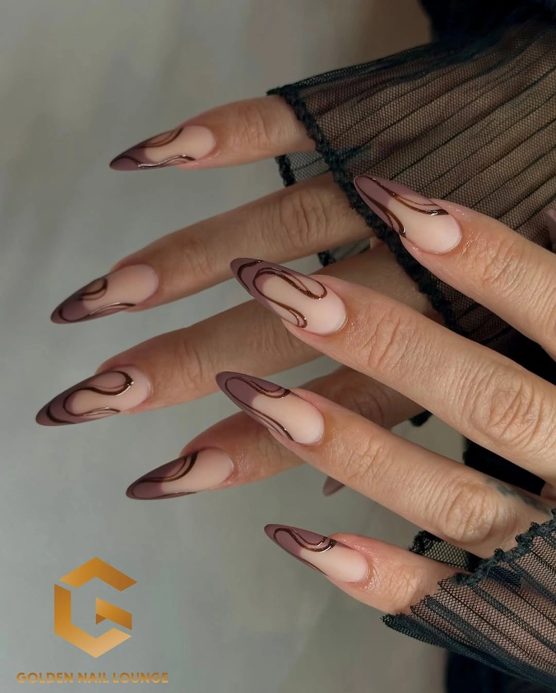 Long almond wedding nails with sheer nude base and chocolate contour lines