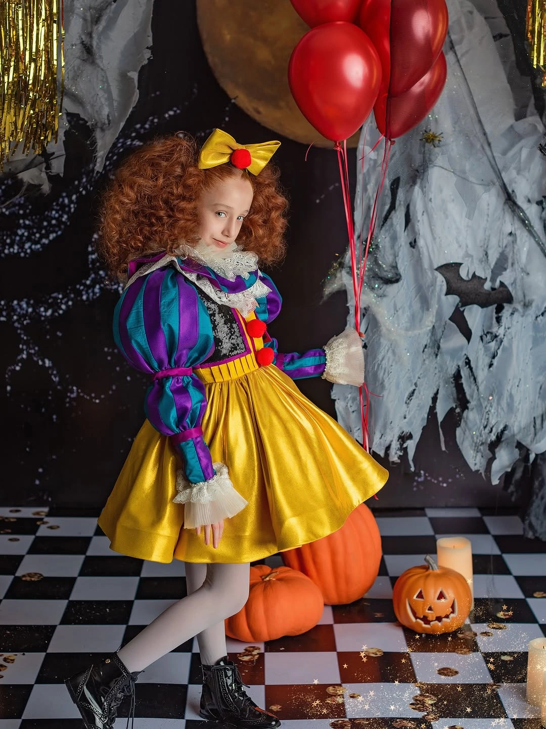 Snow White child costume with blue and purple puff sleeves yellow dress red bow red balloon and black boots