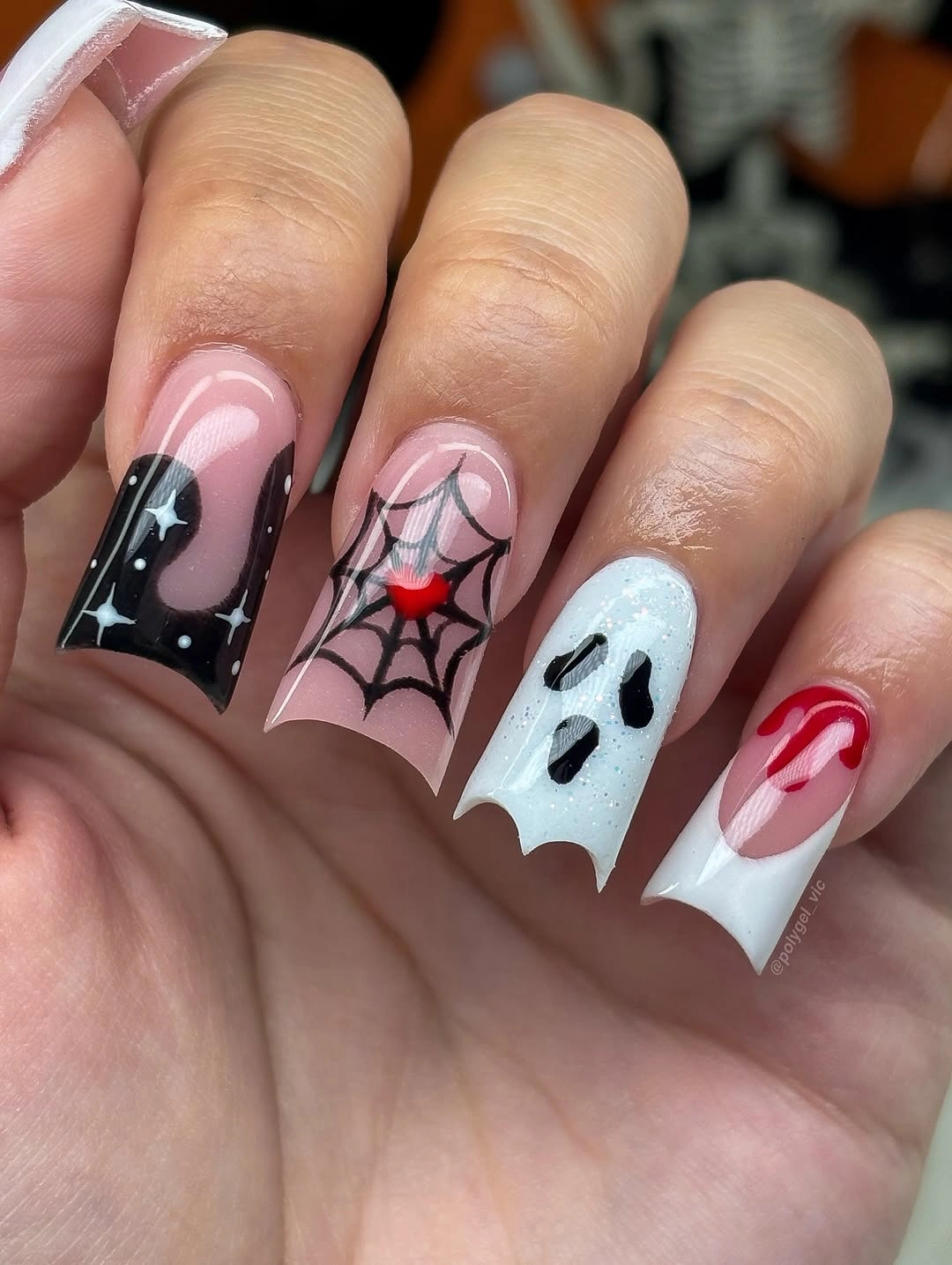 Medium square black pink white and red nails with Halloween graphics