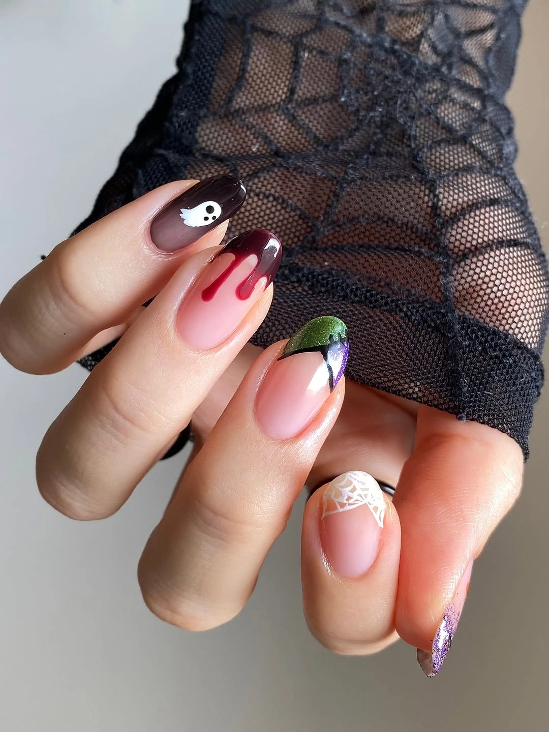 Long pink almond nails with black white and red Halloween graphics