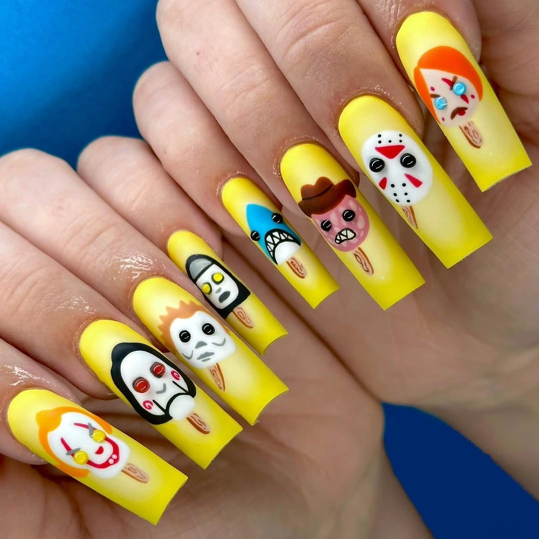 Long square neon yellow nails with illustrated Halloween panels