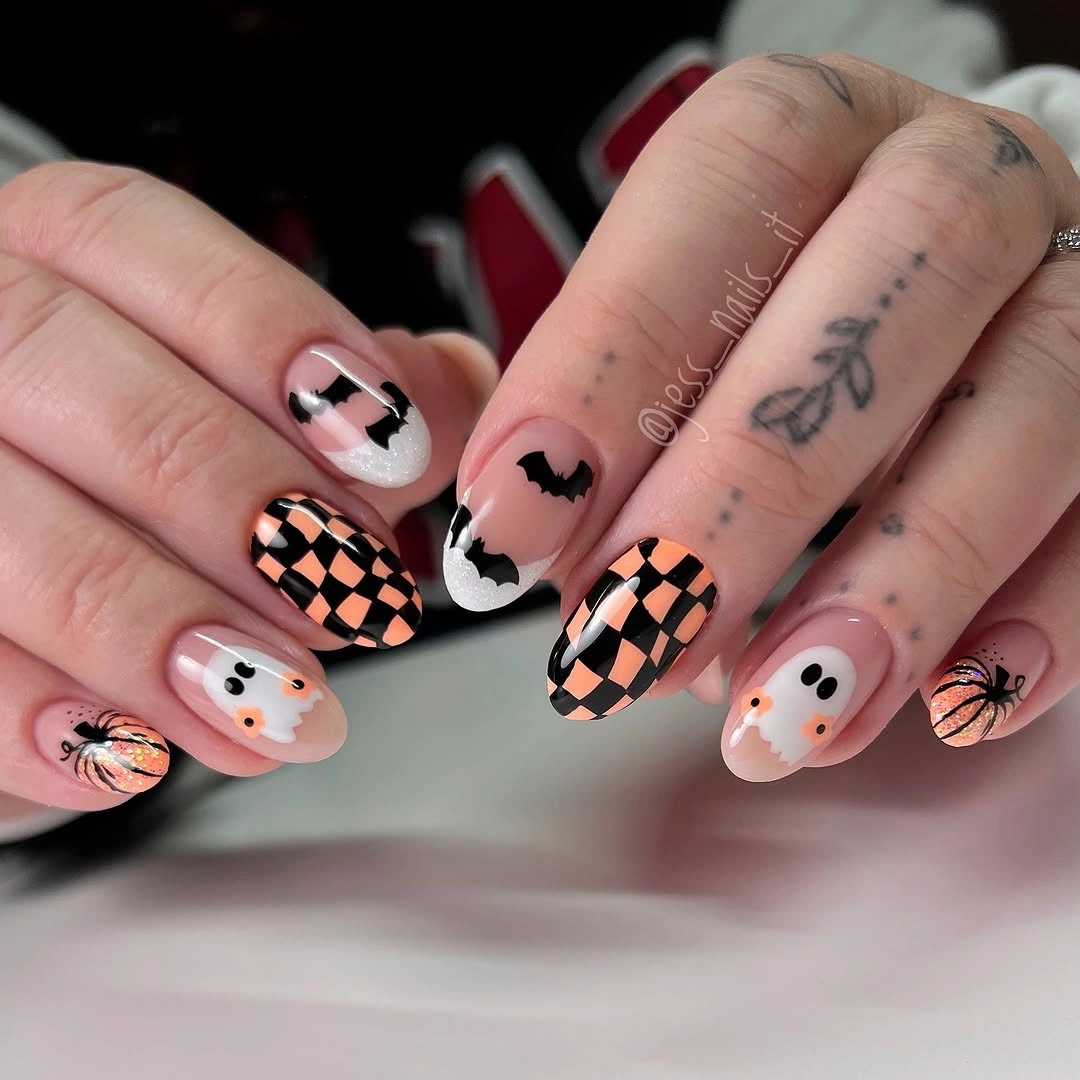 Medium square nails with checkerboard panels and cute Halloween icons