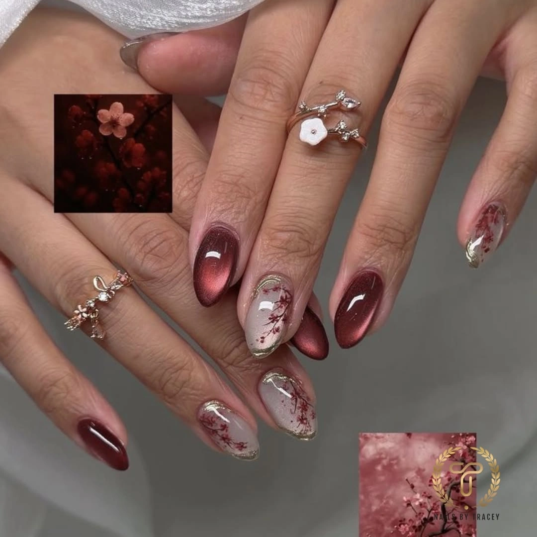 Wine almond nails with pale floral and leaf like accent art