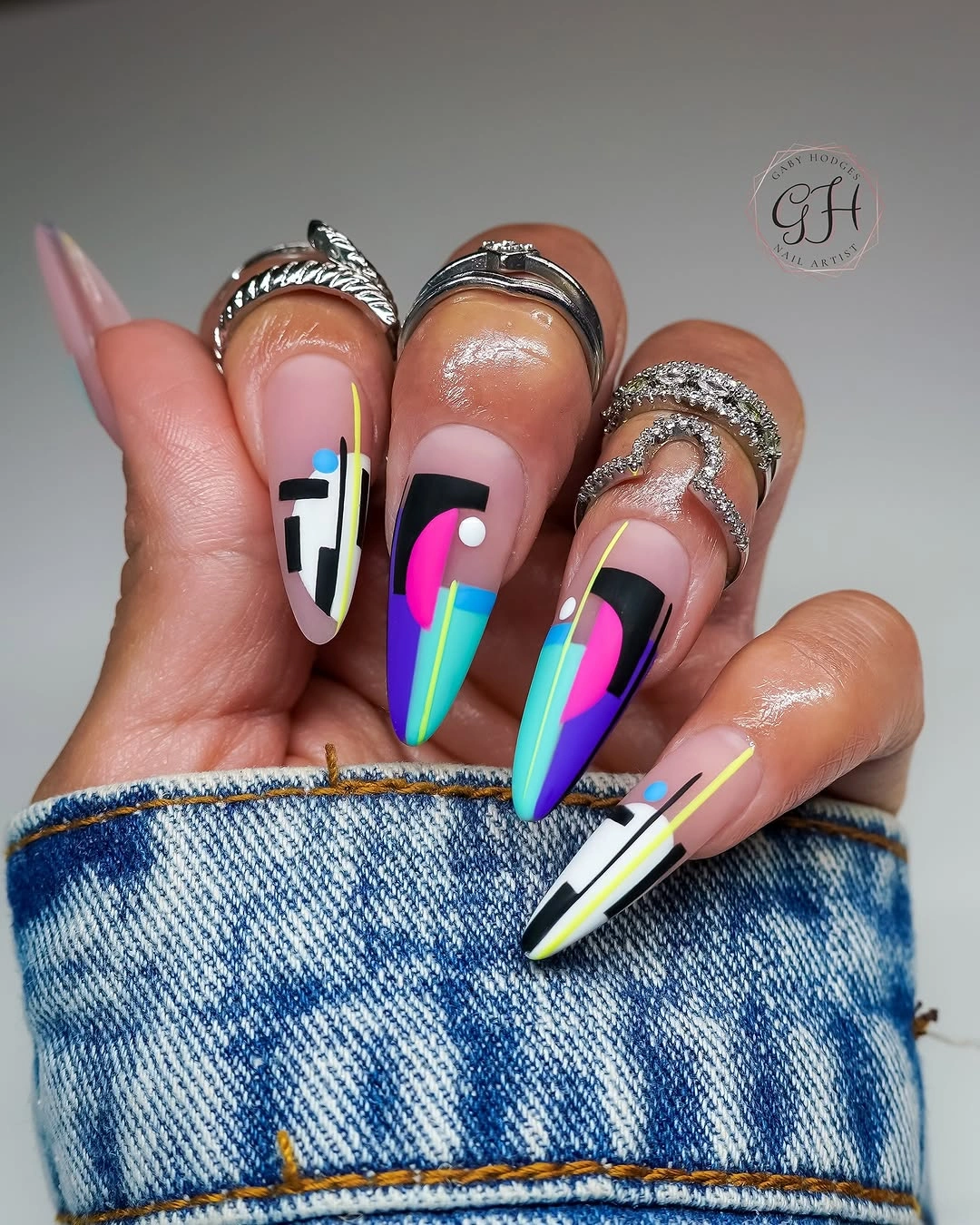 Long abstract nails with black white and neon geometric color blocks