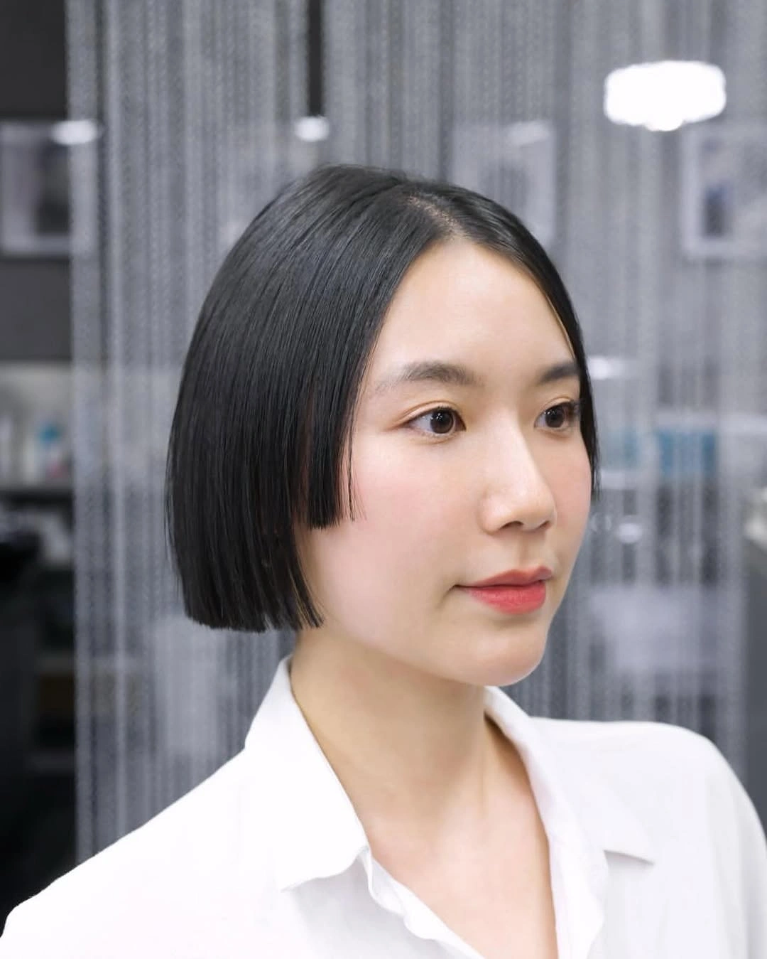 sleek black bob with rounded middle part shape