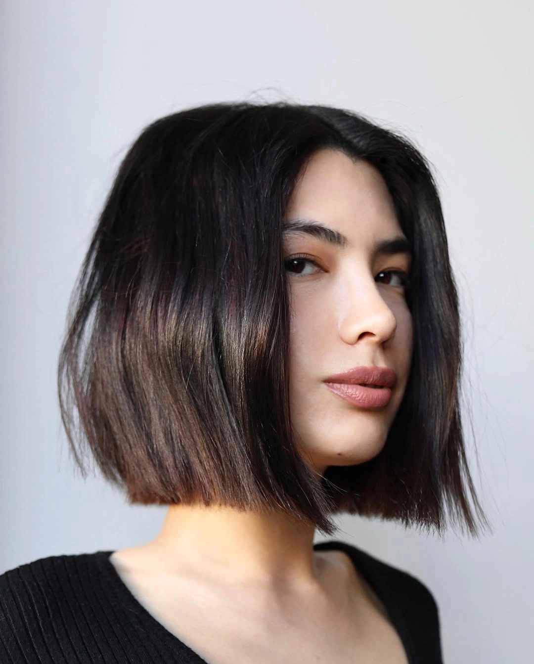 dark jaw length bob from a three quarter view