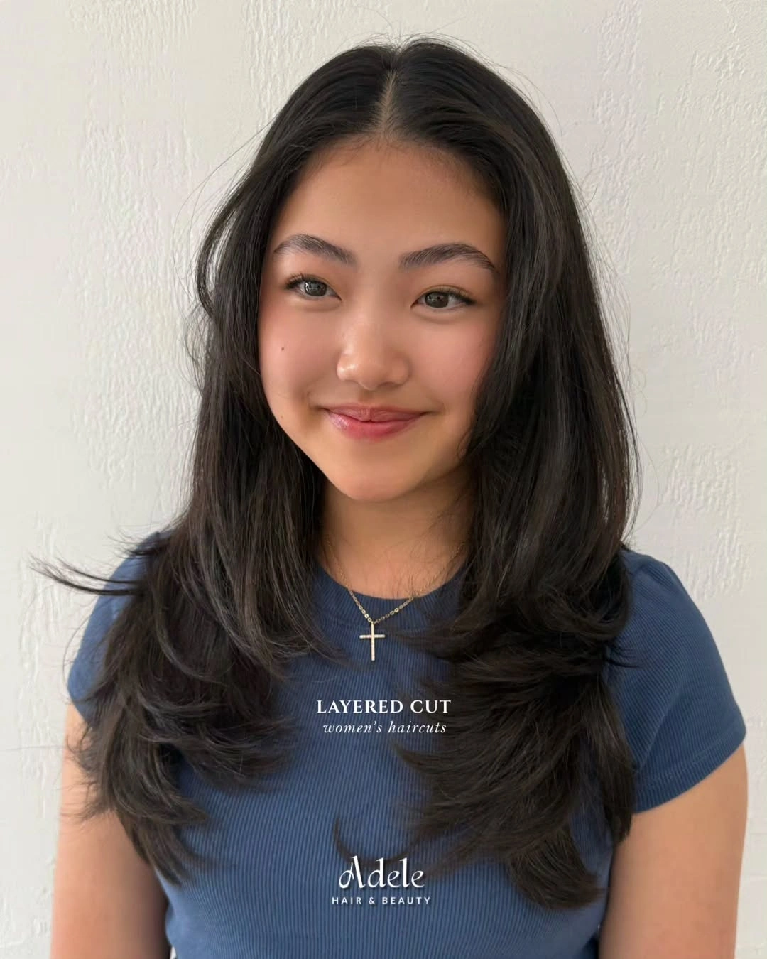 medium dark layered cut with center face framing