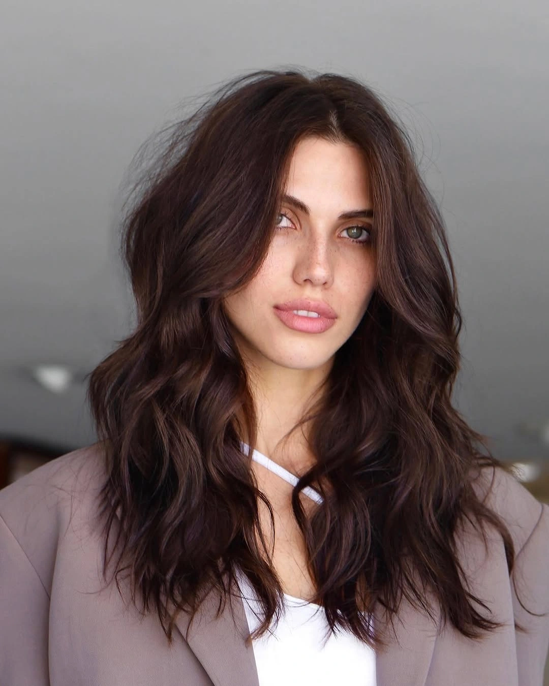 long deep brunette waves with soft center framing