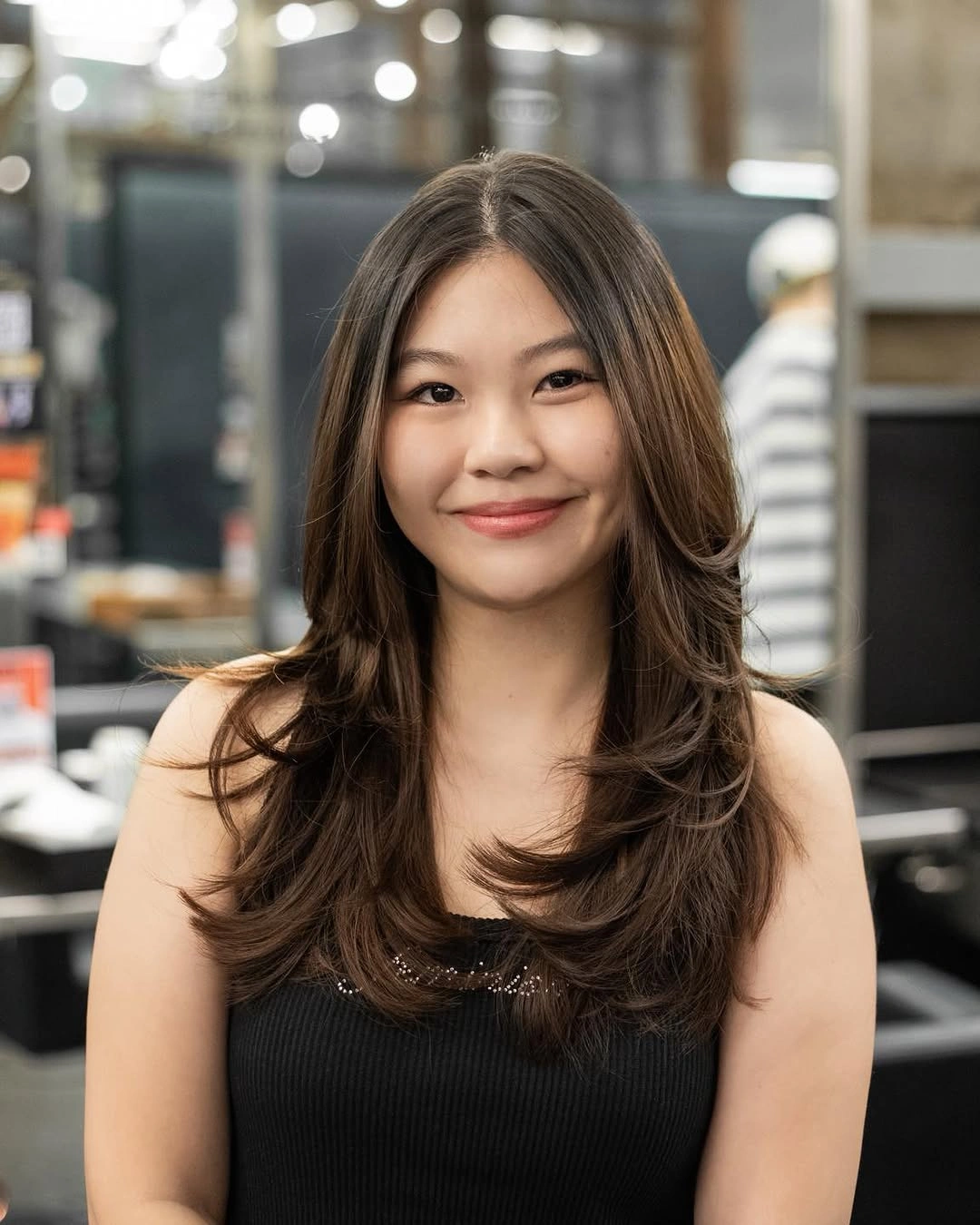 long brunette hair with lifted center part layers