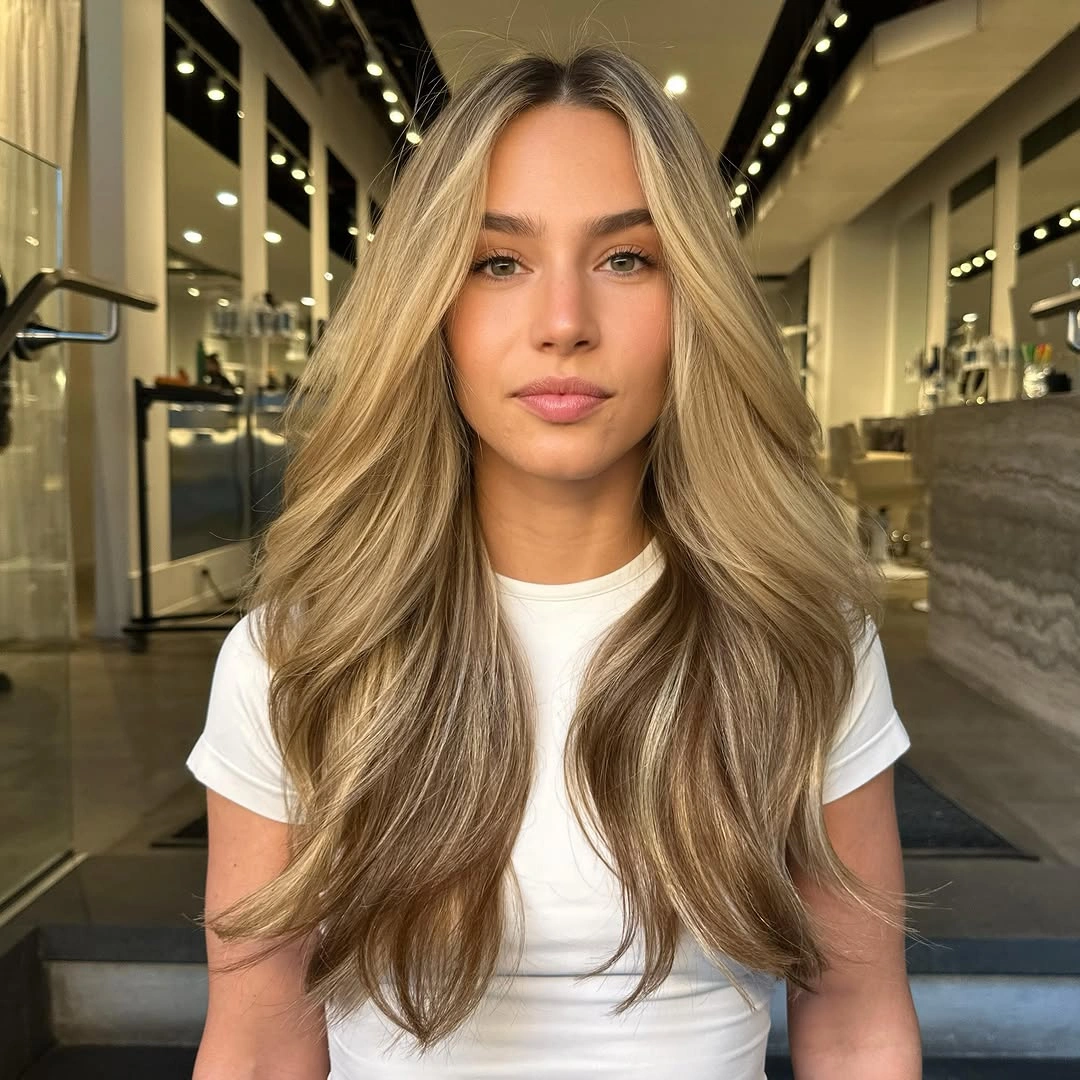 long honey blonde waves with centered part