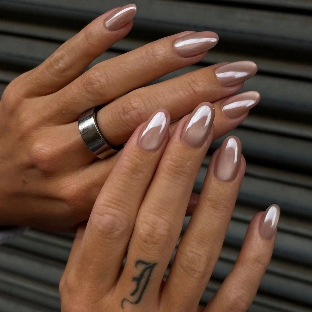 Medium almond nails in dusty mauve with a pearly glossy shine