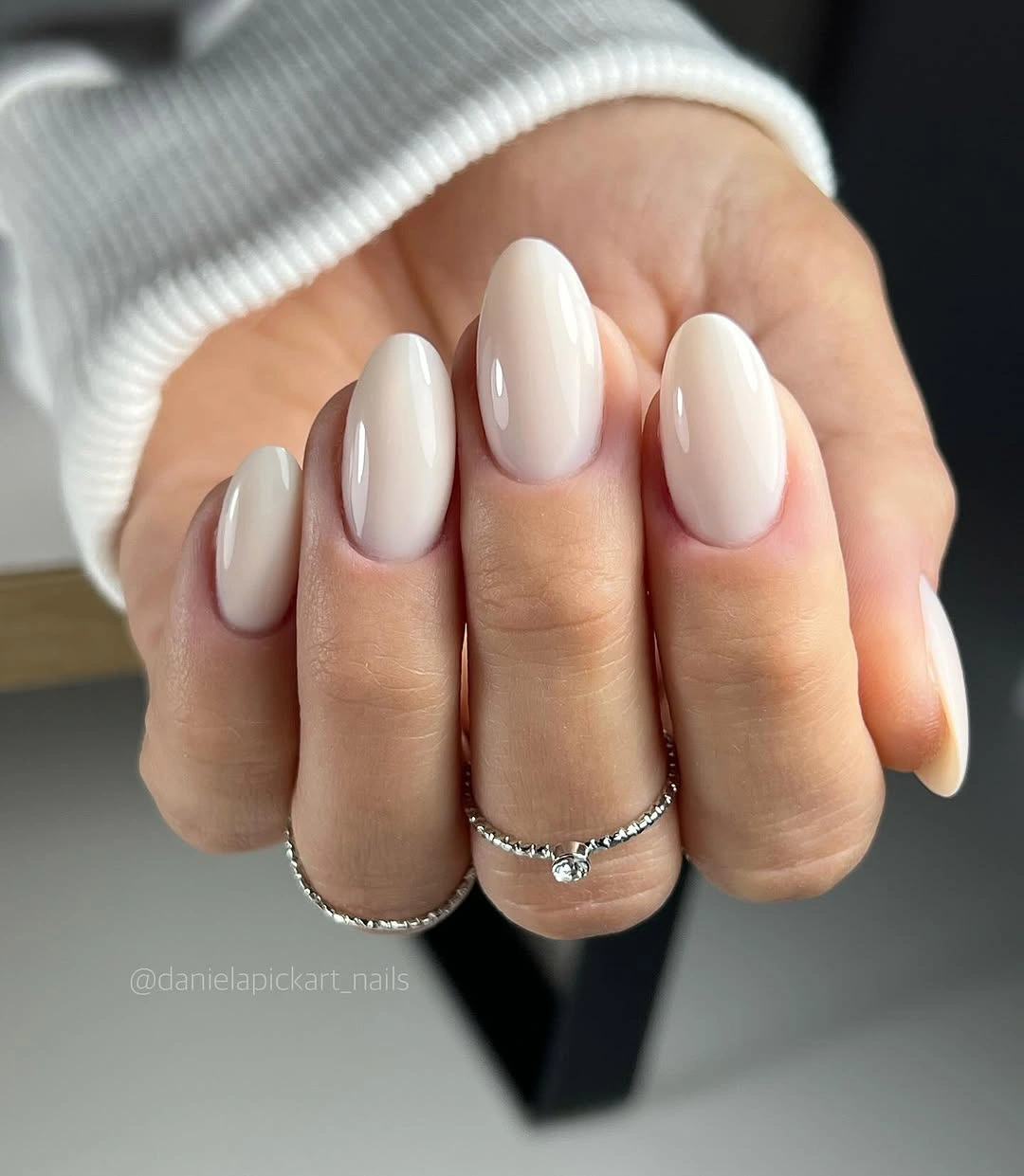 Medium almond nails in creamy warm beige ivory and nude neutral shades