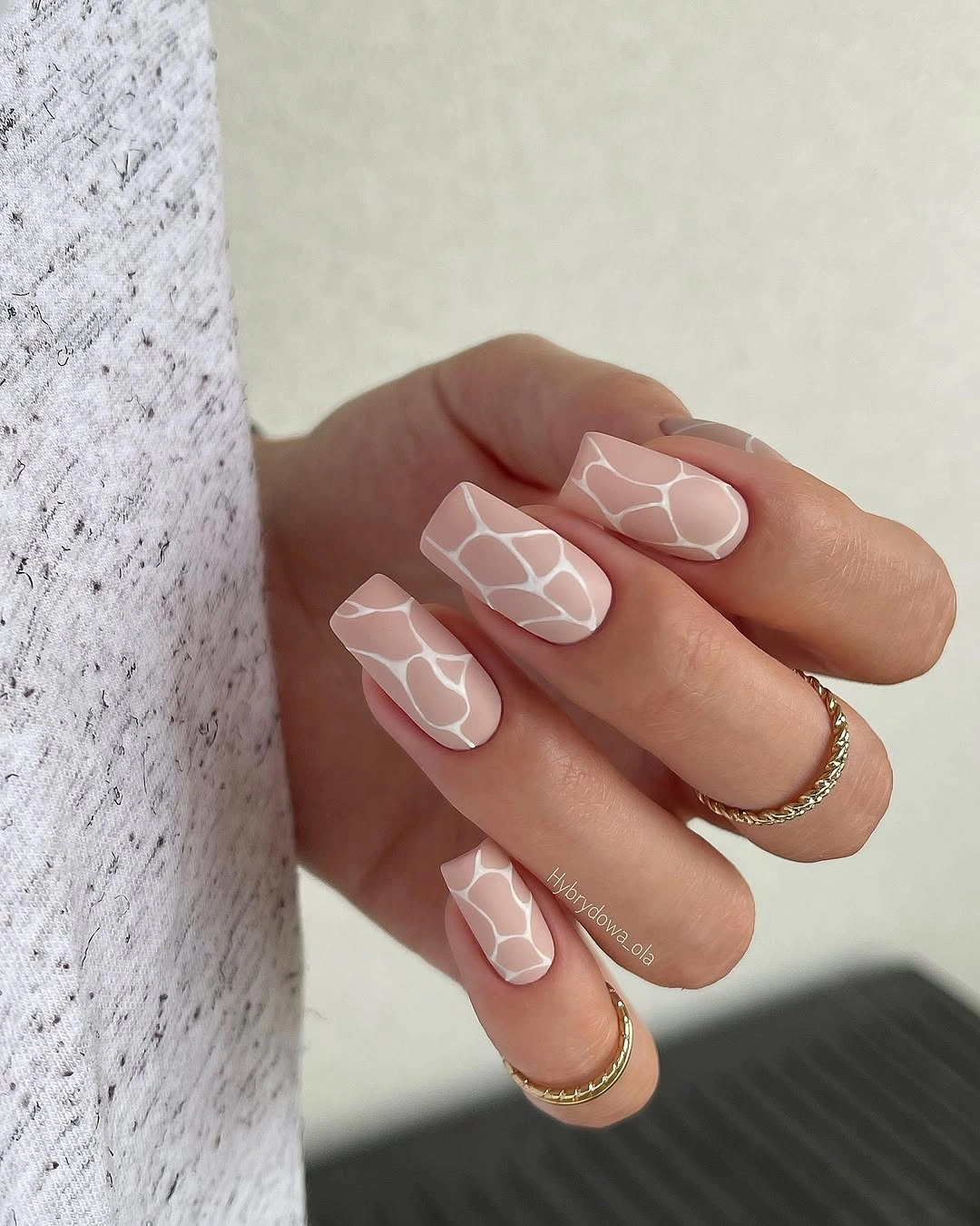 Short nude square nails with delicate white botanical linework