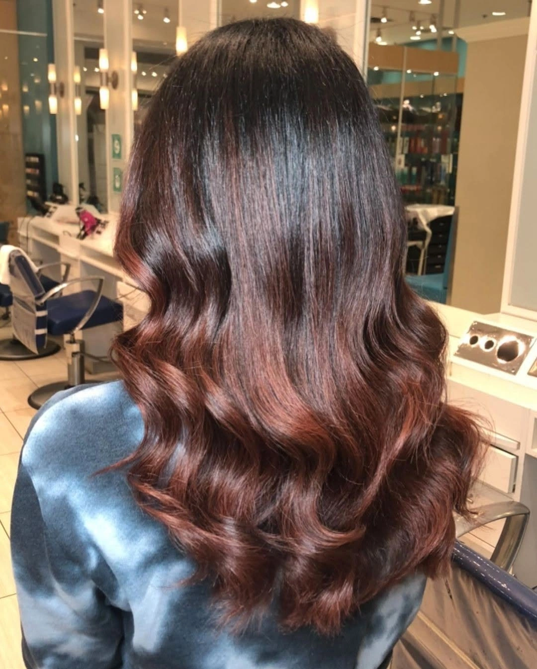 Long chocolate brown waves with subtle muted warm ends and darker crown