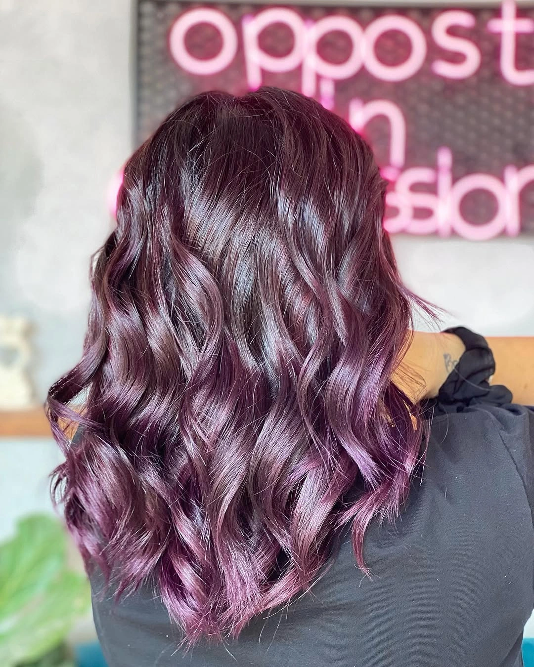 Shoulder-length plum waves with pale lavender ribbons and dark root depth