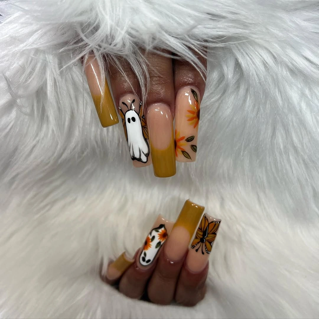 Long nude square nails with mustard tips white ghosts and autumn drawings