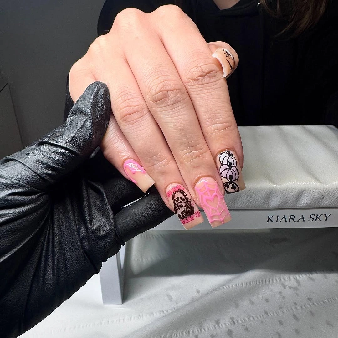 Long hot pink square nails with black graphic collage details