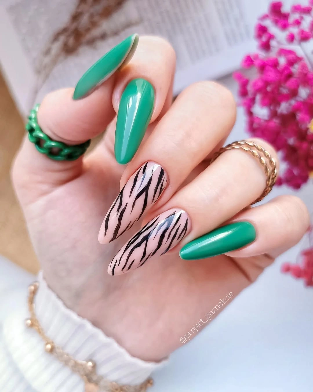 Emerald almond nails with pale pink black zebra accent nails