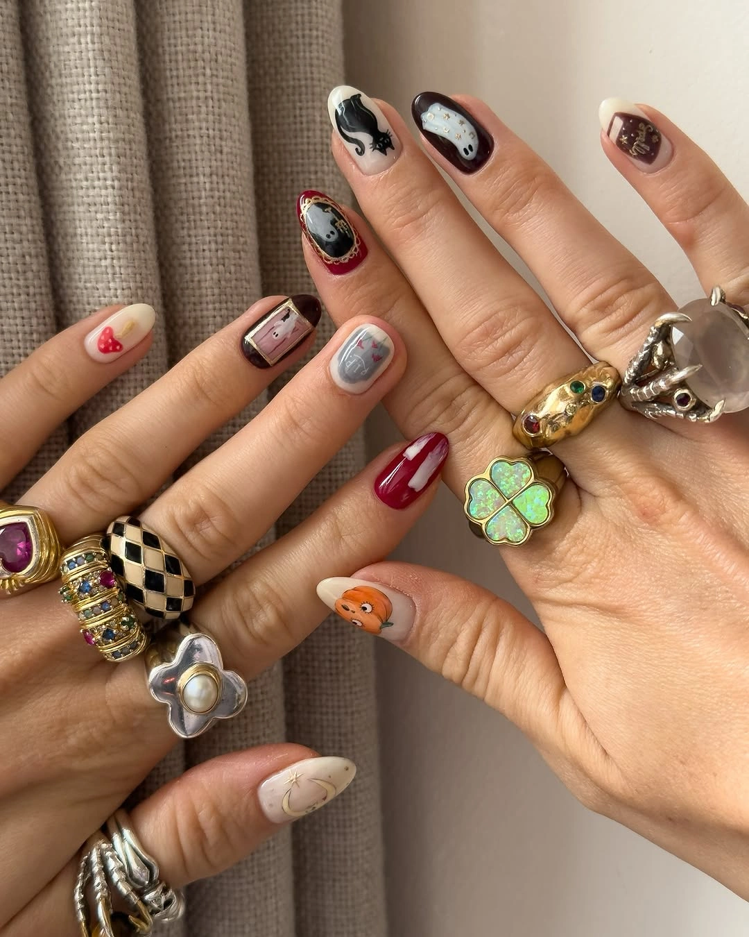 Mixed burgundy nails with checkerboard hearts cherries and tiny icon accents