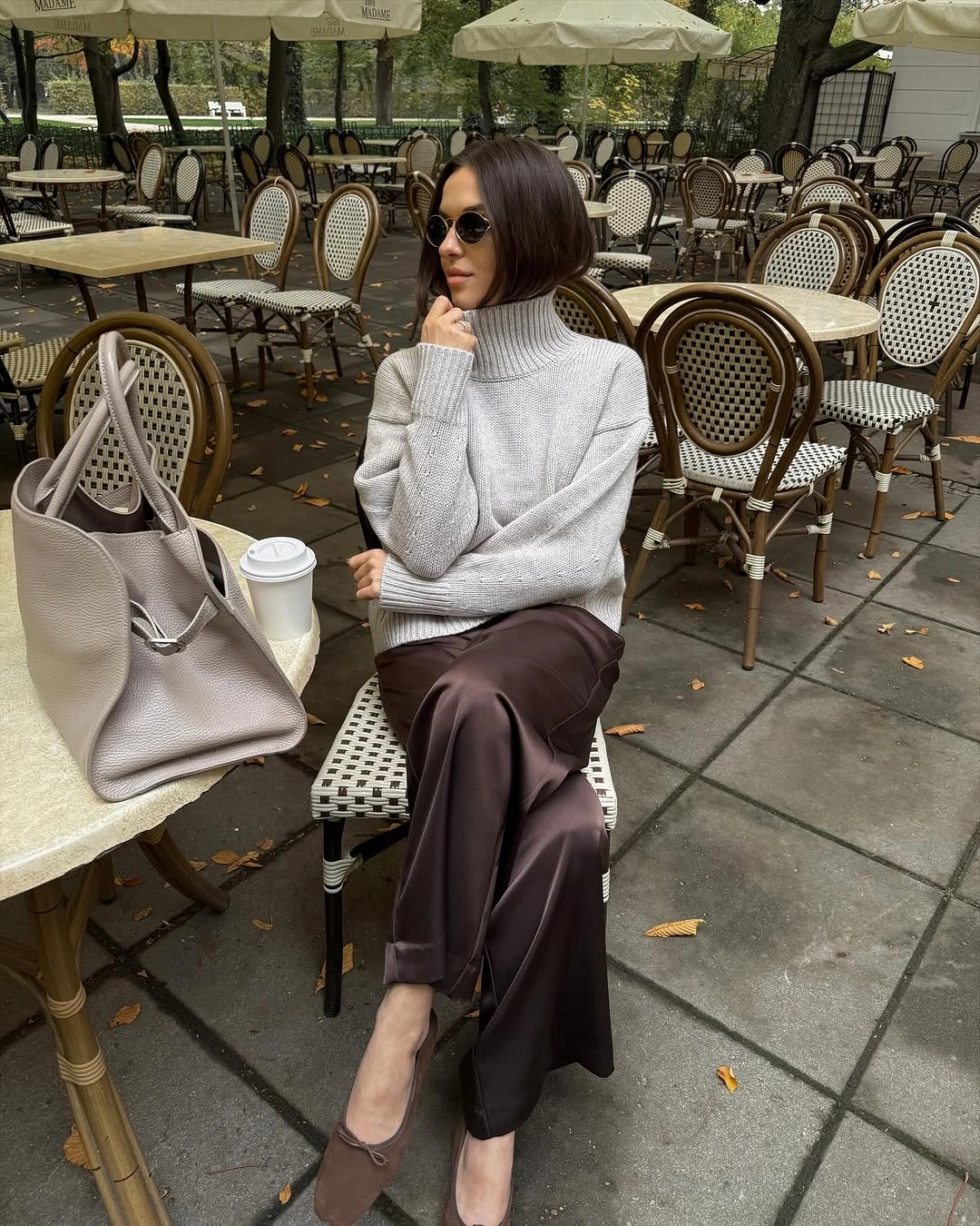 Pale turtleneck with dark brown fluid midi skirt and mules