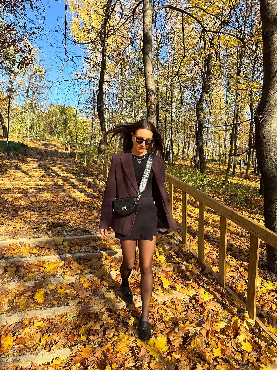 Wine blazer over black mini outfit with tights and ankle boots