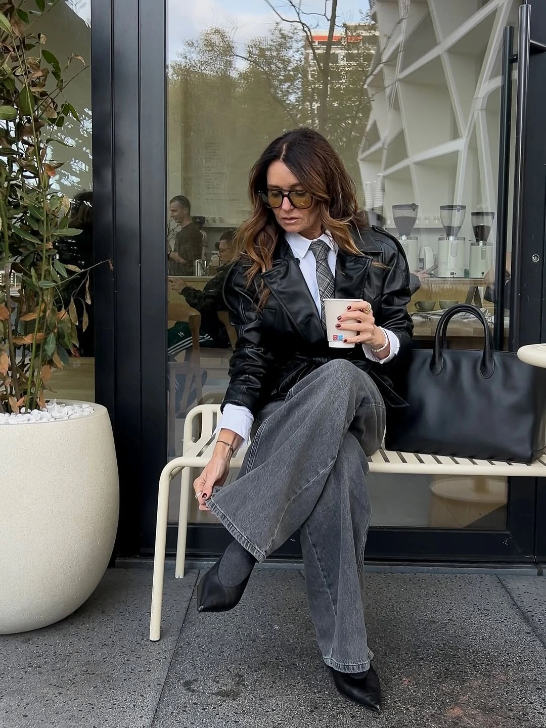 Dark jacket white shirt tie with gray wide-leg jeans