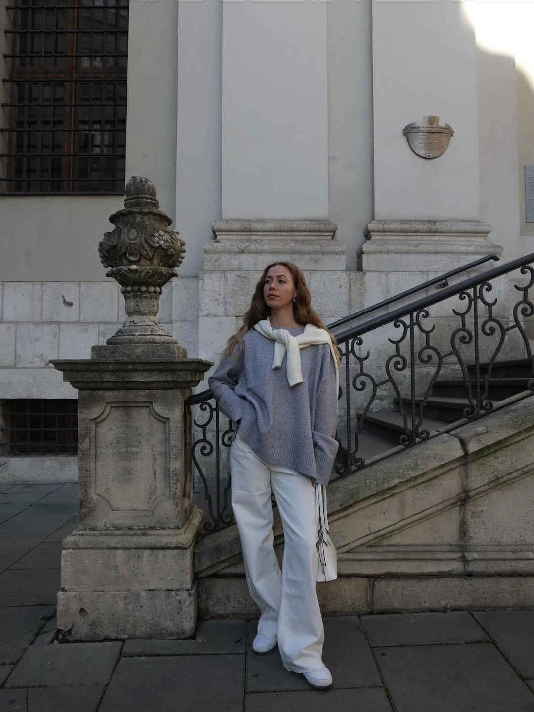 Lilac knit with white wide trousers and white shoes